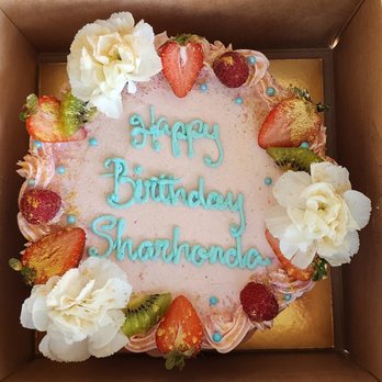Pu'uwai Aloha Bakery - Lemon Cake with Strawberry Frosting decorated beautifully with gold dusted fruits and white carnations - Bakeries Near Me - Honolulu, Hawaii Pu'uwai Aloha Bakery - Lemon Cake with Strawberry Frosting decorated beautifully with gold dusted fruits and white carnations - Bakeries Near Me - Honolulu, Hawaii