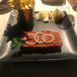 Brasserie historique La Coupole 1912 - Tartare de bœuf Suisse Accompagné de ses girolles