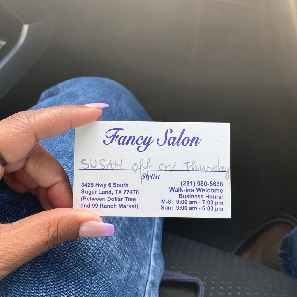 Her business card that shows her name and hours.