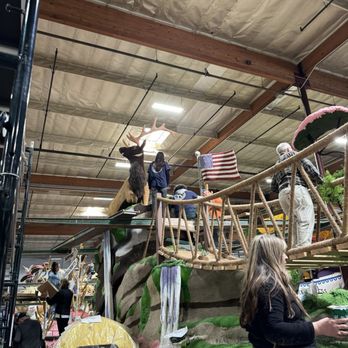 Phoenix Decorating Co - Volunteers working on the float with a deer on it - Party & Event Planning Near Me - Irwindale, California
