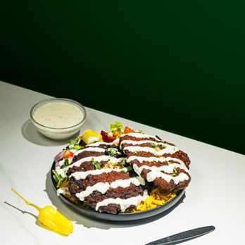 Gyro King - Chapli kabab over rice with a choice of salad and sauce - Mediterranean Near Me - New York, New York Gyro King - Chapli kabab over rice with a choice of salad and sauce - Mediterranean Near Me - New York, New York