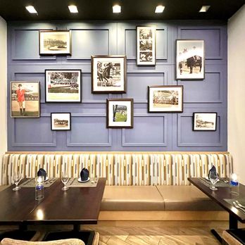 The Bugler - Dining space with racetrack pics on the wall. - Desserts Near Me - Hot Springs, Arkansas