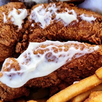 Lea Jane's - A close up of the chicken tenders inside the Plain Jane sandwich. - Chicken Shop Near Me - Houston, Texas Lea Jane's - A close up of the chicken tenders inside the Plain Jane sandwich. - Chicken Shop Near Me - Houston, Texas