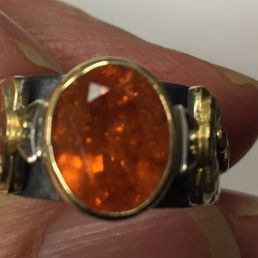 See where the silver oxidation is occurring?  I don't like that so close to the gold and stone.  LOVE THIS RING but not the oxidation. :-(