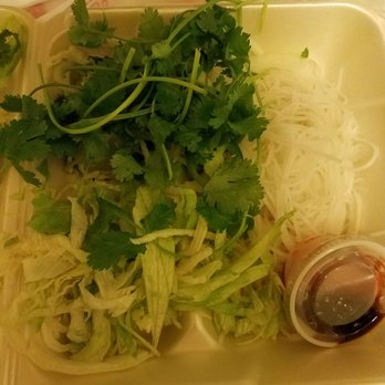 Asia's Finest - This is the garnish for pho. Yup thats iceberg lettuce. No sprouts. Ridiculous. - Vietnamese Near Me - Lansing, Michigan