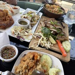 Thai omelette, crab fried rice, grilled squid and grilled pork neck! Must try! Thai omelette, crab fried rice, grilled squid and grilled pork neck! Must try!