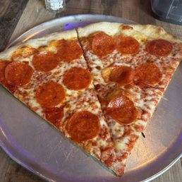 Pepperoni pizza by the slice. Pepperoni pizza by the slice.