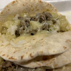 Birrieria Gomez - Picadillo taco, flour tortilla, cheese and onions
