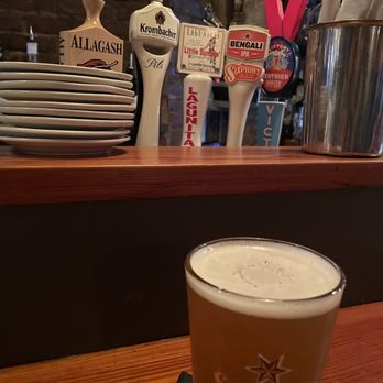 The Milton - a pint of beer on a table - Irish Near Me - New York, New York