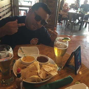 Bombshells Restaurant & Bar - Another day another dollar - Sports Bars Near Me - Houston, Texas