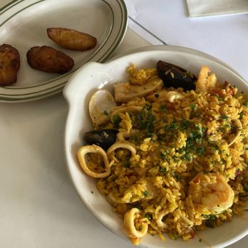Versailles - seafood rice with side of sweet plantain - Cuban Near Me - Miami, Florida