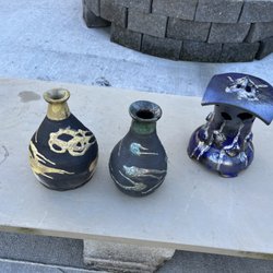 Clay Work Studio - Some raku pots hot out of the fire and smoke.
