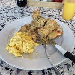 Thumbs Up Diner - Fried Chicken Biscuit and Gravy multi-grain biscuit topped with fried chicken fingers and sausage gravy served with 2 eggs
