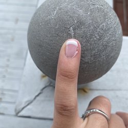 Lovely Nails - They didn't even clean the edges after top coat. It already started to peel..