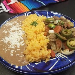 Torres Mochas - Bistek Ranchero - tender steak cooked lightly w/ onions, bell peppers, jalapeños w/ sides of rice, frijoles & 3 homemade flour tortillas.