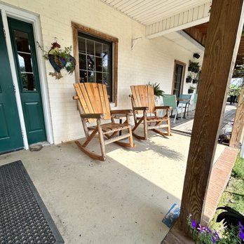 Brewing Tree Beer Company - a porch with rocking chairs - Brewpubs Near Me - Afton, Virginia