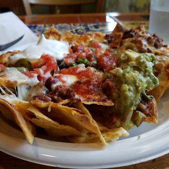 Tres Amigos Mexican Grill - Tex-Mex Chili Nachos. Nothing special, but it was run under the salamander so the cheese was browned. That was nice. - Mexican Near Me - Greenlawn, New York