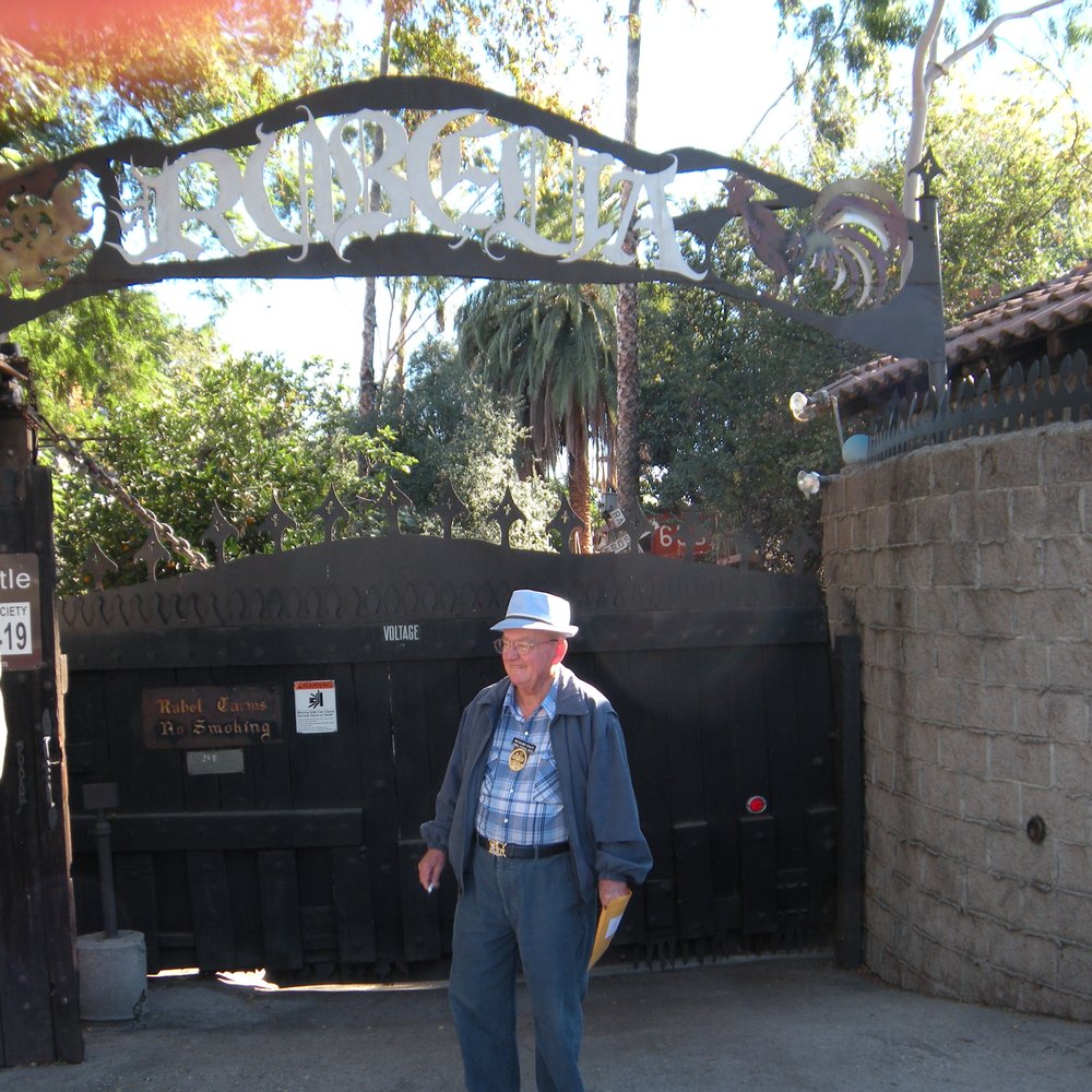 Rubel Castle - Our Docent Guide in front of Rubel Castle Main Gate - Museums Near Me - Glendora, California