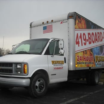 Quest Restoration - a delivery truck parked in a parking lot - General Contractors Near Me - Toledo, Ohio Quest Restoration - a delivery truck parked in a parking lot - General Contractors Near Me - Toledo, Ohio