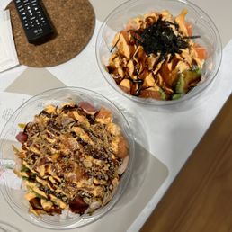 two bowls of food on a table two bowls of food on a table