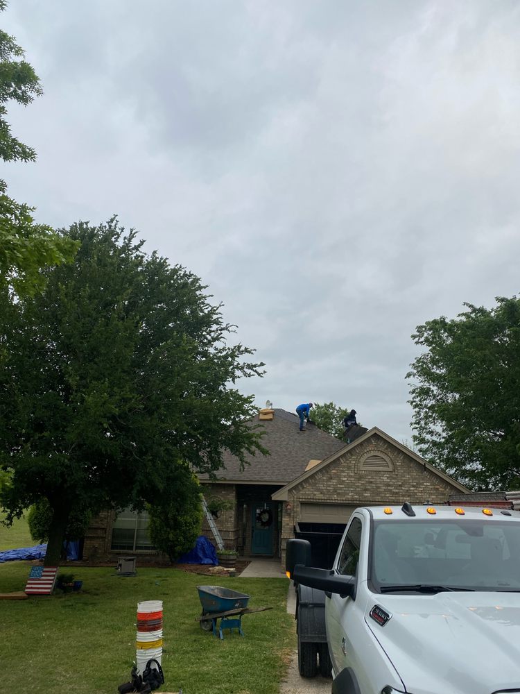 Slide of Mann & Sons Roofing