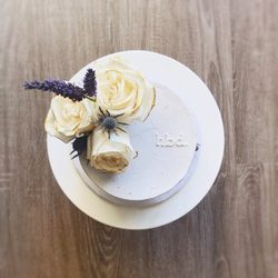 Bakes by Eileen - Celebration Cake (small) with fondant lettering and small fresh floral arrangement.