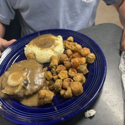 Hamburger steak, okra, mashed potatoes and brown gravy. All homemade.