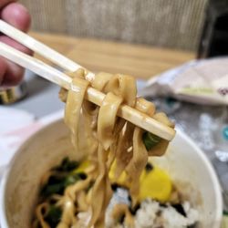 Asia Market - Bulgogi Alfredo Tangle package noodles with added kimbap, pickled radish, and green onion from the self-serve noodles station