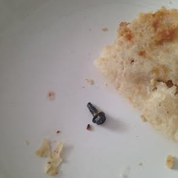 India Pavilion - Here's the screw my husband found in his leftovers from dinner last night at India Pavilion. Awesome. - Indian Near Me - Cambridge, Massachusetts