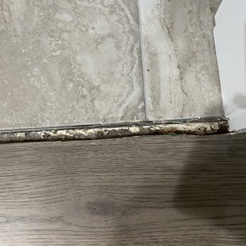 Interior Design Concepts - Close up of the transition between the tile and hardwood floor. - Interior Design Near Me - Windsor, Colorado