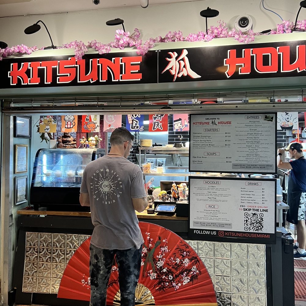 Kitsune House - a man standing in front of a restaurant - Chinese Near Me - Miami, Florida Kitsune House - a man standing in front of a restaurant - Chinese Near Me - Miami, Florida