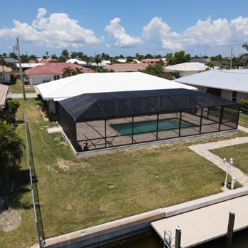Lester's Aluminum - Pool enclosure with composite roof. Screen patio - Patio Coverings Near Me - Cape Coral, Florida Lester's Aluminum - Pool enclosure with composite roof. Screen patio - Patio Coverings Near Me - Cape Coral, Florida
