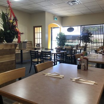 Red Brick Wall - a restaurant with tables and chairs - Vietnamese Near Me - St Albert, Alberta Red Brick Wall - a restaurant with tables and chairs - Vietnamese Near Me - St Albert, Alberta