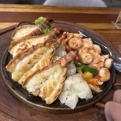 NAU - Grilled shrimp and lobster tails with rice and broccoli