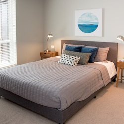 The McMillan - Master Bedroom With Carpeting