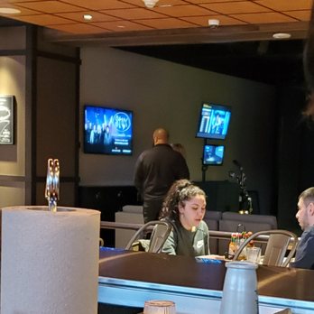 Dos Gatos Cantina - That's Kyle my bartender watching tv with his back to us instead of behind the bar.. - Mexican Near Me - Monticello, New York