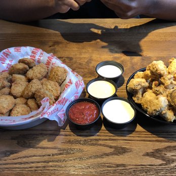 Hideaway Pizza - Fried pickles on the left. Fried mushrooms on the right. Sauces: ranch, marinara, and specialty sauce. - Pizza Near Me - Fort Smith, Arkansas