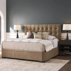 Colorado Style Home Furnishings - Luxury upholstered bed with tufted headboard and neutral bedding creates an inviting bedroom at Colorado Style Home Furnishings in Denver