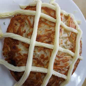 Mrs Potato - Rosti. The filling is under the hash browns. The stripes are cream cheese. - Brazilian Near Me - Orlando, Florida Mrs Potato - Rosti. The filling is under the hash browns. The stripes are cream cheese. - Brazilian Near Me - Orlando, Florida