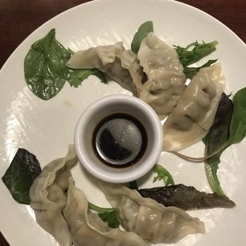 Ginza Sushi - Gyozas as an appetizer. We were too hungry and snapped a pic after we took a bite. ‍ - Sushi Bars Near Me - Honolulu, Hawaii