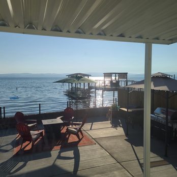 M&M Lake Haven - Patio view from inside of living room. - Vacation Rentals Near Me M&M Lake Haven - Patio view from inside of living room. - Vacation Rentals Near Me