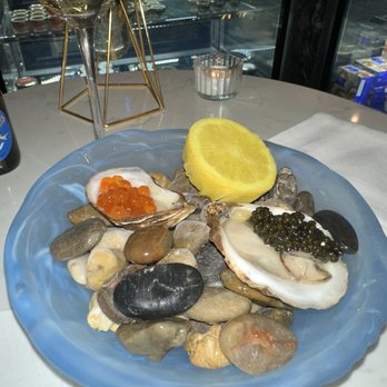Number One Caviar Boutique - 2 oysters, one with caviar and the other with salmon roe - Seafood Markets Near Me - New York, New York Number One Caviar Boutique - 2 oysters, one with caviar and the other with salmon roe - Seafood Markets Near Me - New York, New York