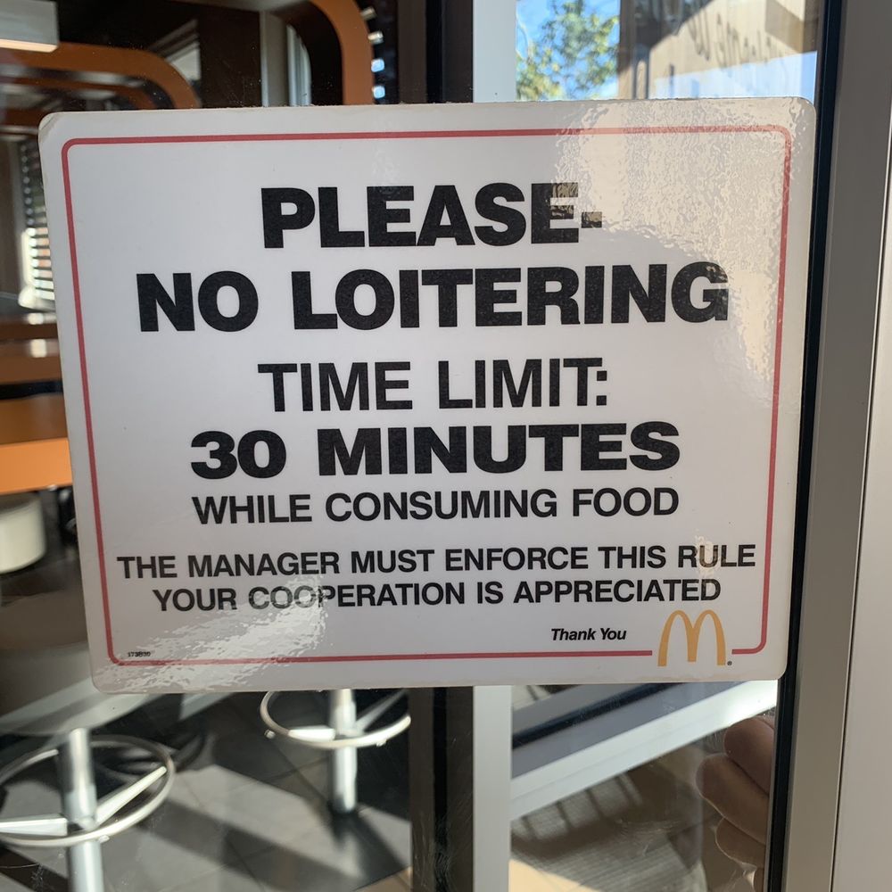 a no - lotering time limit sign a no - lotering time limit sign