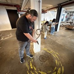 Norsk hermetikkmuseum - My husband cleaning the floors of the factory