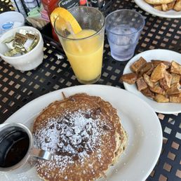 Chocolate chip pancakes and side of potatoes Chocolate chip pancakes and side of potatoes