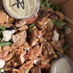 Blackened chicken salad, black beans, greens, cojita, crispy onions, tomatoes and an avocado ranch dressing