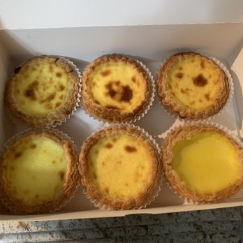 Double Crispy Bakery - Mostly Portuguese eggs tarts. One regular Chinese egg tart bottom right. - Bakeries Near Me - New York, New York Double Crispy Bakery - Mostly Portuguese eggs tarts. One regular Chinese egg tart bottom right. - Bakeries Near Me - New York, New York