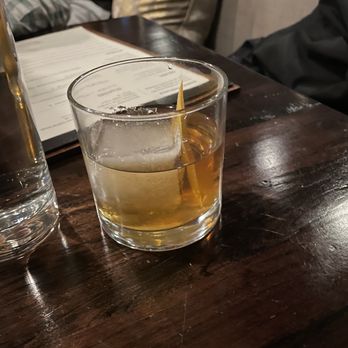 Tupelo Park City - a glass of whiskey on a table - New American Near Me - Park City, Utah