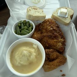 Fried Chicken, mashed potatoes and gravy, green beans and bread.