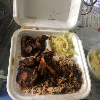 Irie Mon Cafe - No oxtails on the bone and half a serving of cabbage.. just sad! - Caribbean Near Me - Atlanta, Georgia Irie Mon Cafe - No oxtails on the bone and half a serving of cabbage.. just sad! - Caribbean Near Me - Atlanta, Georgia